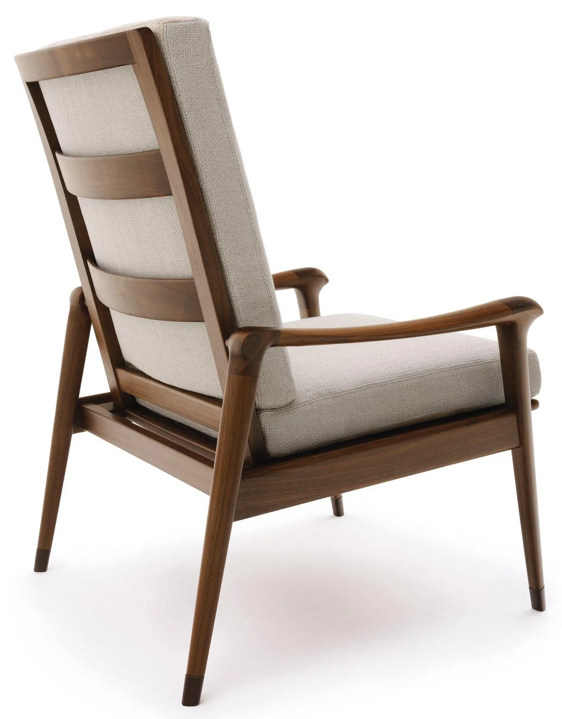 A high-back armchair with a visible timber frame and separate pale cushions.